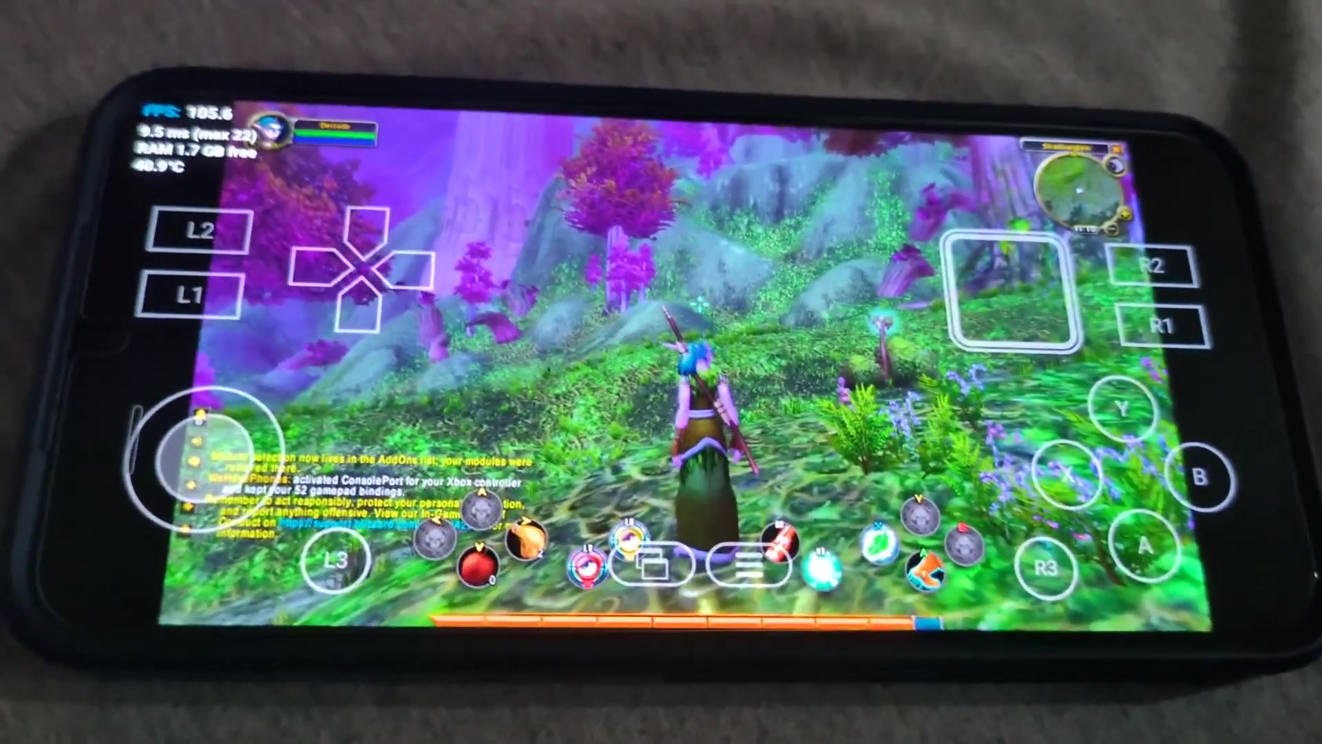 World of Warcraft running on an Android phone, with touch controls in Teldrassil